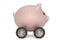 Pink piggy bank and four wheels.3D illustration