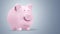 Pink piggy bank on light background