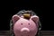 Pink Piggy bank locked, chained with black background, Protect savings, Protect capital, Protect retirement fund concept