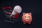 Pink piggy bank, trolley and light bulb, power savings concept