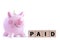 pink piggy bank and wooden blocks with text