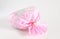 Pink Plastic gift bag with ribbon on white