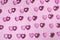 Pink plastic hearts background