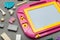 Pink plastic magnetic drawing board, toy for learning to draw