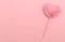 Pink plastic pen with a heart-shaped decoration made of soft fluffy faux fur