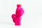 Pink plastic pony toy inside with slime. White background. Popular antistress game