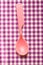 Pink plastic tableware spoon