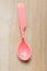 Pink plastic tableware spoon