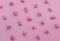 Pink popcorn on paper background. Pastel pattern. Top view.