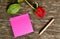 Pink post it note and red rose