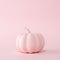 Pink pumpkin on a pastel pink background. Minimal Halloween concept