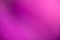Pink and purple abstract blurred background with gradients.