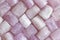 Pink purple background of natural stones. Kunzite is a natural p