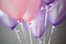 pink and purple helium balloons background, varieties shade of pink.