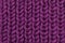 Pink purple knitted textures of wool close-up macro