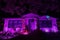 Pink and Purple Lit Halloween House Glowing in the Dark