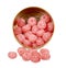 Pink raspberry candies in metal box. Delicious fruit caramel sweets in container