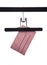 Pink receipt dangling from a black hanger