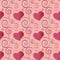 Pink and red hearts and flourish seamless pattern in a festive design