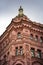 Pink and red historical building Bazin House in Russian style. Decorative facade with turrets, windows, stucco. Saint-Petersburg,