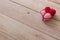 Pink and red kniiting hearts tie up together represent soulmate concept forever on wooden table as background. Love photo concept