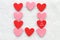 Pink and red Valentine hearts on a white background