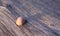 Pink Rhodochrosite gemstone on wood background