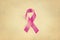 Pink ribbon, breast cancer awareness symbol, Vintage on paper grain background