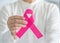 Pink ribbon for breast cancer awareness and women`s health care campaign concept on female tumor illness in October month