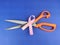 Pink ribbon with Scissors , fight with breast cancer Concept, Selective Focus.