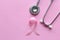 Pink ribbon and stethoscope on pink background, Symbol of breast cancer in women, Health care concept
