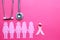 Pink ribbon and stethoscope on pink background, Symbol of breast cancer in women, Health care and Medical concept