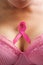 Pink ribbon in woman chest