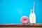 Pink ring donut and milk bottle
