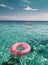 Pink Ring Floating on Water