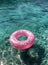 Pink Ring Floating on Water