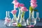 Pink rose flowers in chemical flasks over blue