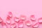 Pink rose petals on pink background. Valentine or wedding abstract background.