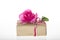 Pink rose on recycle gift box on white background