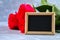 Pink roses with a blank chalkboard for text. Copy space for text. Template for March 8, Mother\'s Day, Valentine\'s Day.