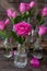 Pink roses in little bottles