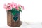 Pink roses in a wicker basket and linen fabric