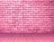 Pink rough brick wall grunge texture pattern for background in rural room. Backdrop for cafe. Abstract sweet stonewall wallpaper