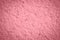 Pink rough wall texture background with copy space. Abstract pacific pink texture background.