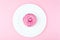 Pink round donut at bright pink background