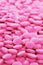 Pink round medicine tablet