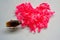 Pink rubber heart shape and small cockroach