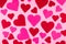 Pink Saint Valentine`s day background with red and pink hearts