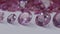 Pink sapphires diamonds of various sizes are centered on a white background