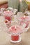 Pink scented candles in glass candle holders